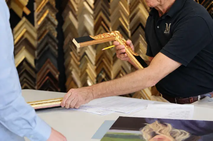 A Masten framing consultation with artwork and moulding samples