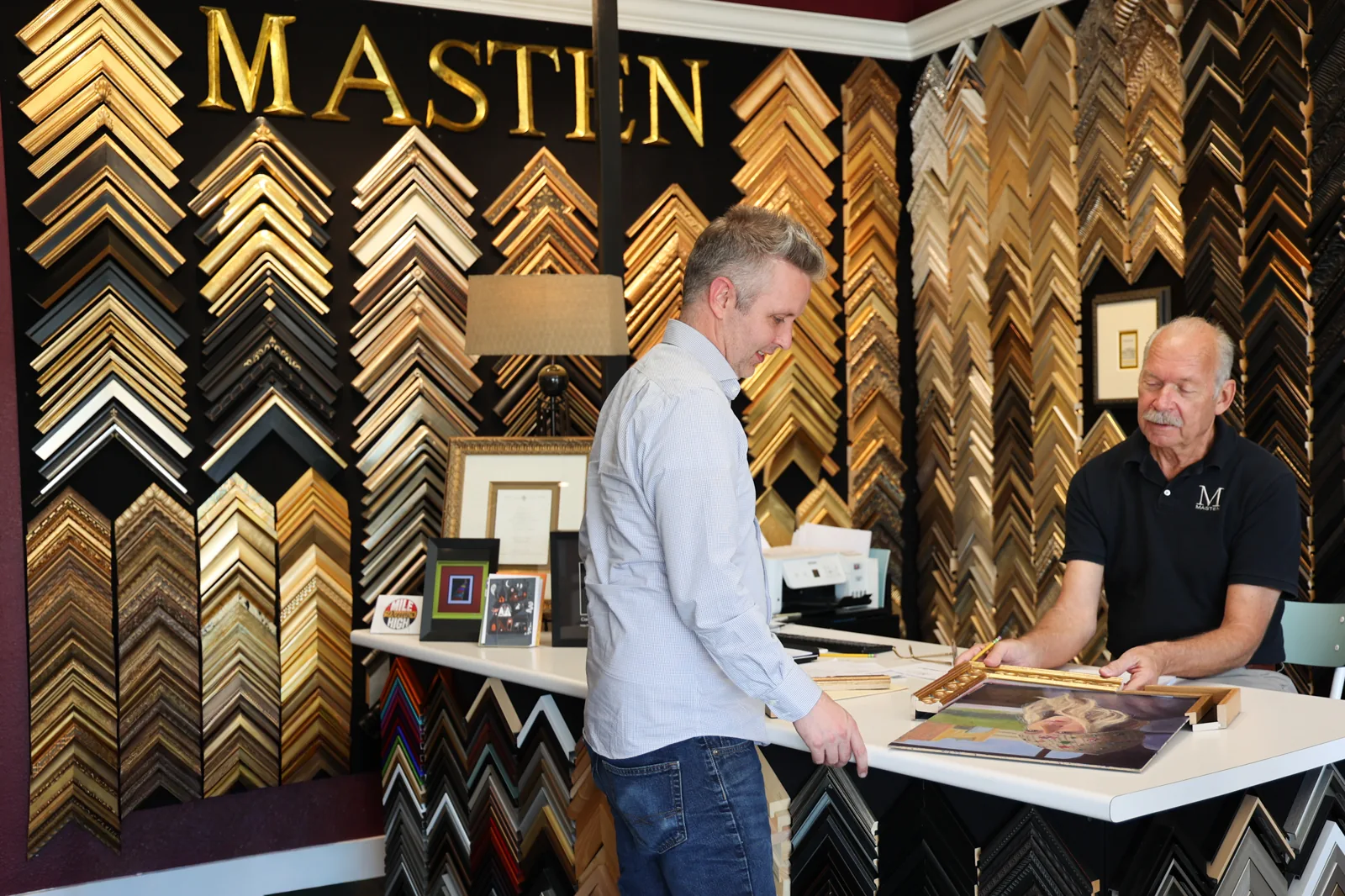 People reviewing framing options together in the real Masten showroom